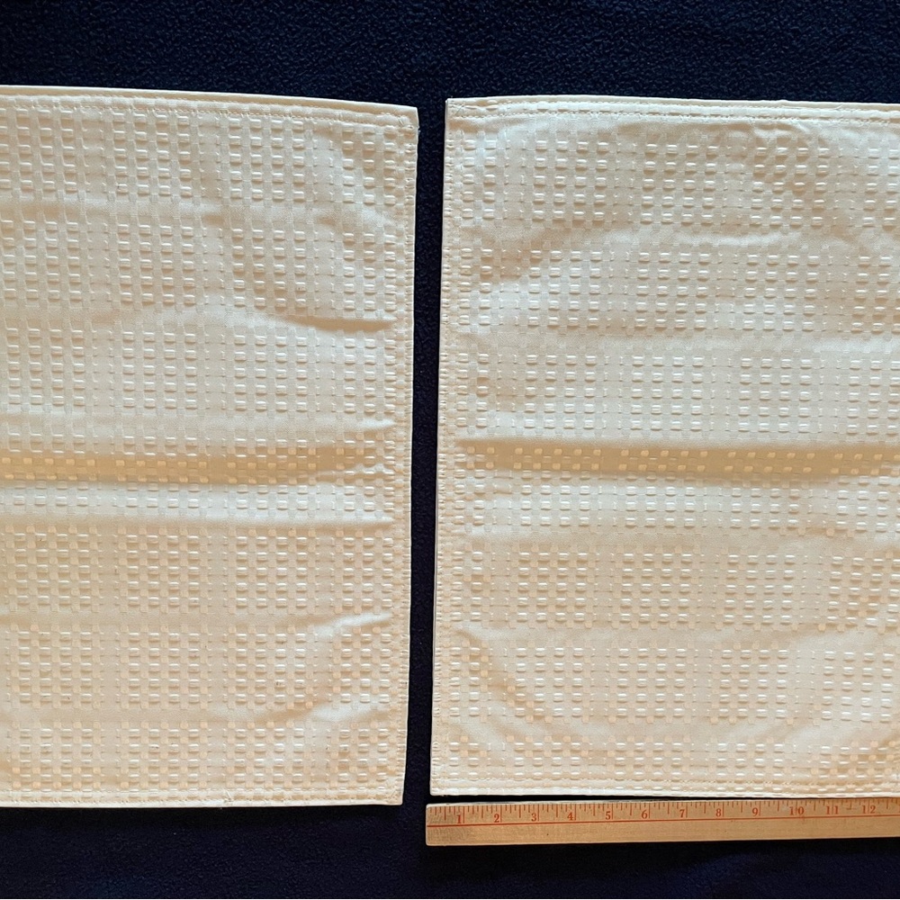 New Ivory placemats with basket weave pattern 13 x 18 inches.